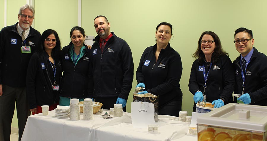 An "Ice Cream Social" hosted by representatives of the Doctors Council and senior members of the hospital's administration and medical staff, including, l. to r.,  COO Wayne Zimmermann, Drs. Isha Mehta and Jasmine Dave, CFO David Guzman, Chief Implementation Officer Jeannith Michelen, Dr. Suzanne Bentley, and Patient Experience Officer Pierre Pham.